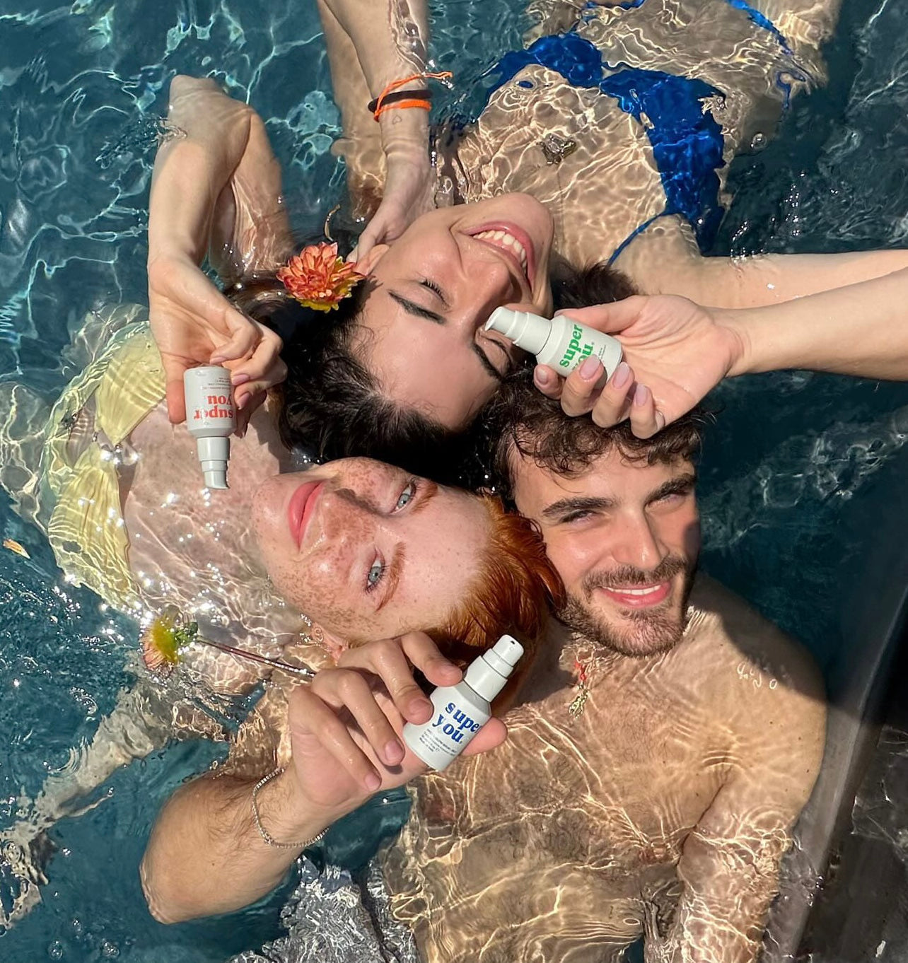 Applying SuperYou serum on the beach