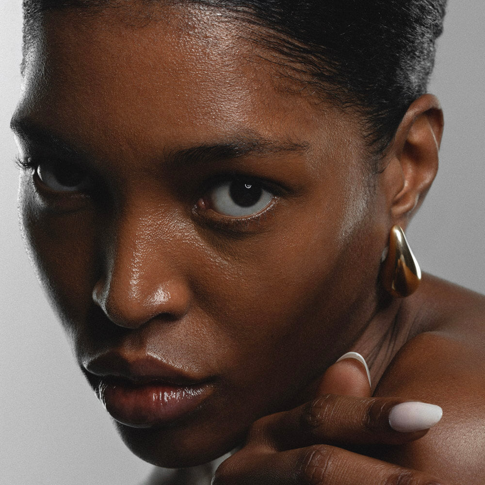 Woman following a skincare routine for sensitive skin using cleanser serum moisturizer SPF adapted for dry oily combination and acne-prone skin.