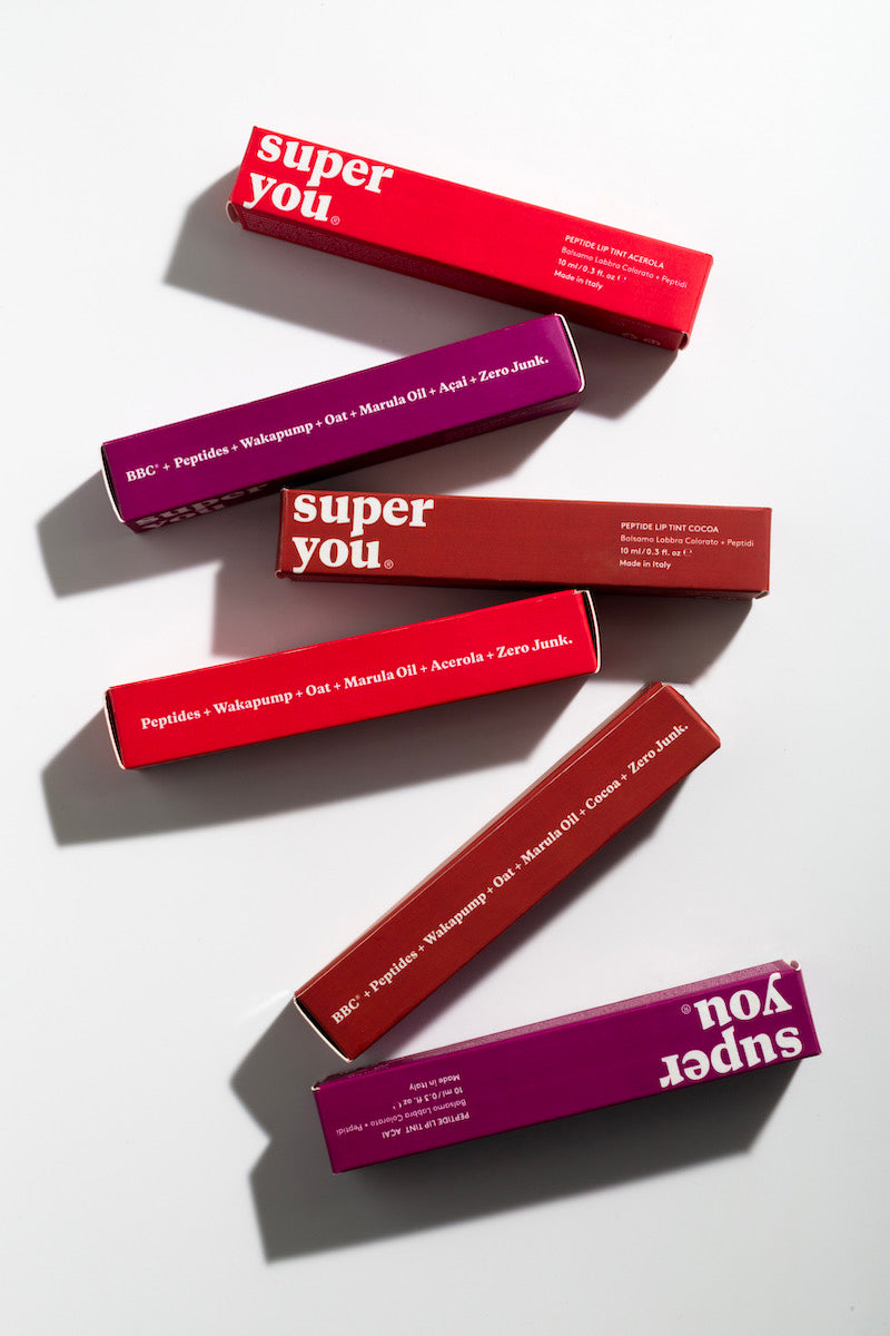 Eco-friendly cosmetic packaging made with recyclable glass, FSC paper and sustainable materials.